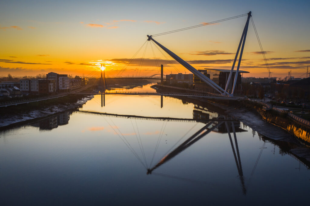 An aerial view at sunrise of Newport city centre, south wales United Kingdom, taken from the River Usk